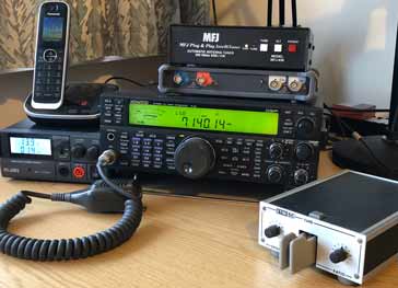 Typical automatic antenna tuner within a compact ham radio station